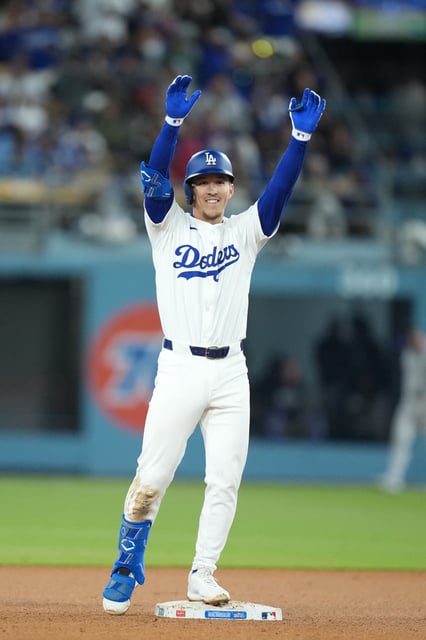 Apr 15, 2025; Los Angeles, California, USA;  Los Angeles Dodgers center fielder Tommy Edman (25) celebrates a double to right field in the bottom of the fifth inning against the Colorado Rockies at Dodger Stadium. Mandatory Credit: Kirby Lee-Imagn Images