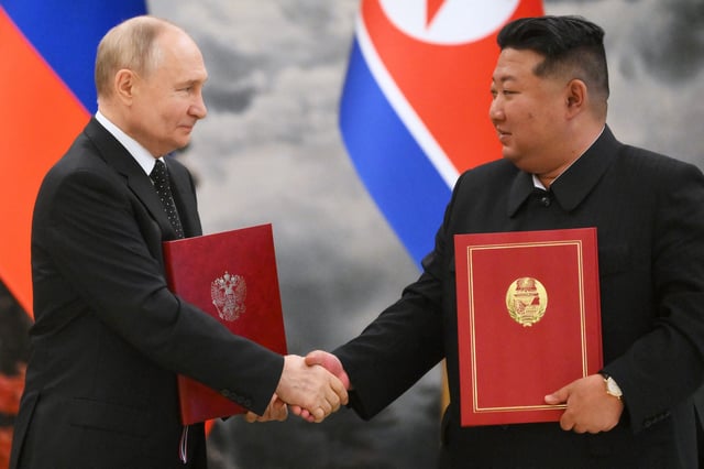 In this pool photograph distributed by the Russian state agency Sputnik, Russian President Vladimir Putin (L) shakes hands with North Korea&#39;s leader Kim Jong Un (R) after a signing ceremony following their bilateral talks at Kumsusan state residence in Pyongyang, on June 19, 2024.