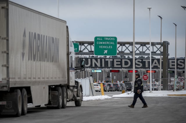 A truck drives on its way to enter the United States at a border crossing at the Canada-US border in Blackpool, Quebec, Canada, on February 2, 2025.
