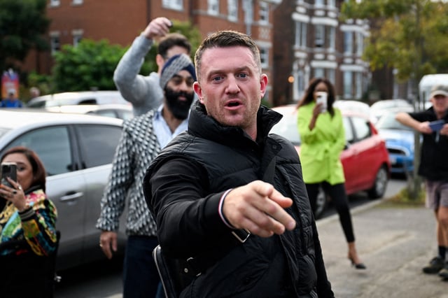 Anti-immigration activist Stephen Yaxley-Lennon, known as Tommy Robinson, gestures before arriving at Folkestone Police Station in Folkestone, Britain, October 25, 2024. REUTERS/Chris J Ratcliffe/File Photo