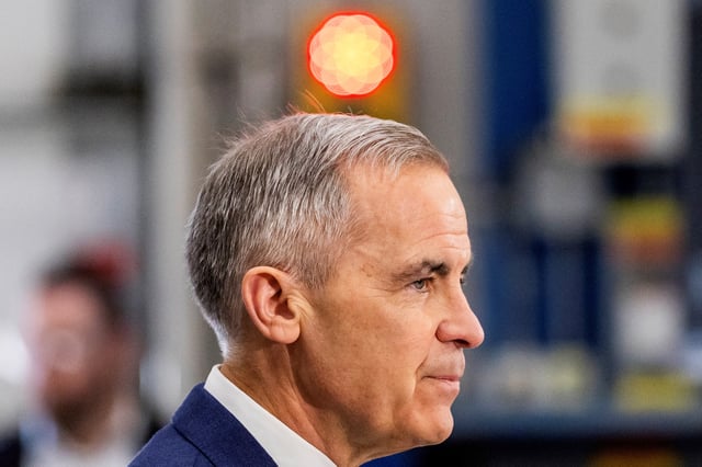 Canada's Prime Minister Mark Carney makes an announcement during his Liberal Party election campaign tour at Nova Bus, in Saint-Eustache, Quebec, Canada April 15, 2025. REUTERS/Carlos Osorio