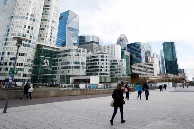 People walk on the esplanade of La Defense in the financial and business district of La Defense, near Paris, France, January 27, 2025. REUTERS/Sarah Meyssonnier/File Photo