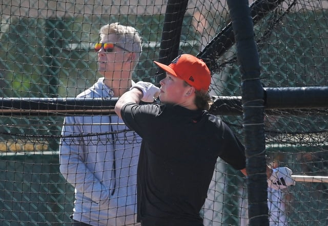 Orioles Executive Vice President and General Manager Mike Elias, left, follows the flight of Jackson Holliday’s fly ball during batting practice in Orioles 2024 Spring Training at Ed Smith Stadium in Sarasota, Fl. (Kenneth K. Lam/Staff)