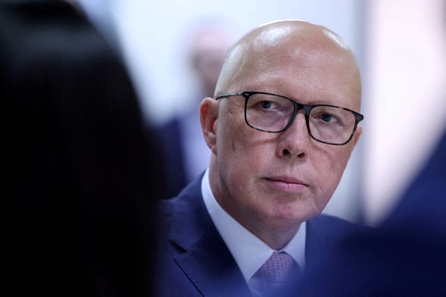 Liberal Party leader Peter Dutton listens during a visit to youth mental health foundation, Headspace, in Parramatta, Western Sydney, Australia, March 23, 2025. REUTERS/Hollie Adams/File Photo