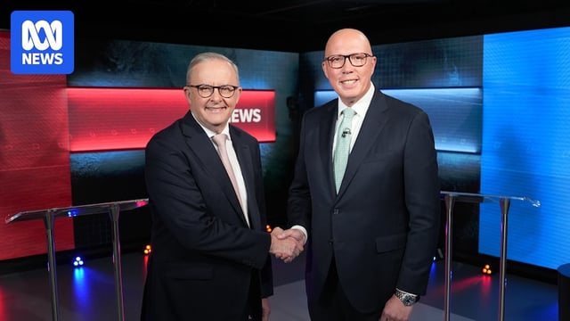 Anthony Albanese shakes hands with albo in the studio