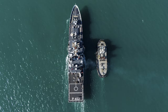 The Italian navy ship Libra approaches the port , as Italian authorities transfer 40 migrants with no permission to remain in the country to Italian-run migration detention centers in Albania, in Shengjin, northwestern Albania, Friday, April 11, 2025. (AP Photo/Vlasov Sulaj)