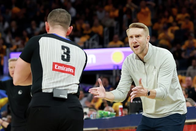 Interim head coach Tuomas Iasalo of the Memphis Grizzlies questions a call during their game against the Memphis Grizzlies in the second half of the NBA play-in tournament game at Chase Center on April 15, 2025 in San Francisco.
