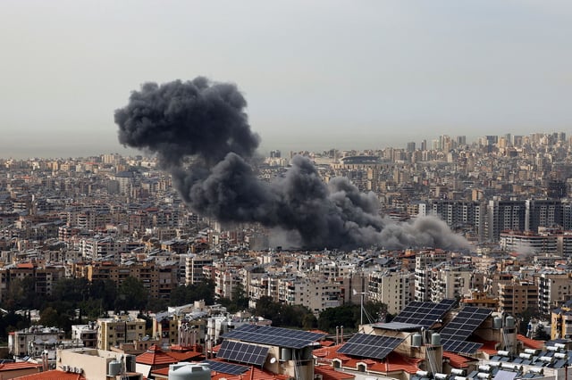 Smoke billows over Beirut's southern suburbs following Israeli strike, as seen from Baabda, Lebanon on March 28.