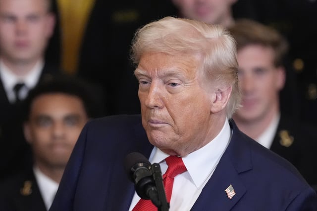 President Donald Trump speaks during the Commander-in-Chief trophy presentation to the Navy Midshipman football team in the East Room of the White House, Tuesday, April 15, 2025, in Washington.