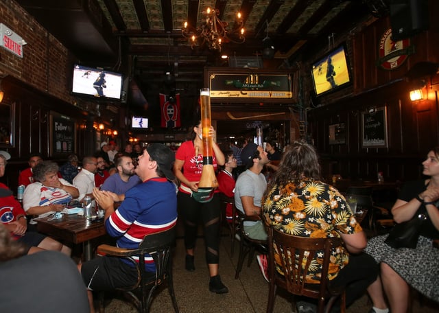 Montreal Canadiens hockey fans gather to watch the second away game of the Stanley Cup Finals, against Tampa Bay Lightning, at Macleans Pub in Montreal, Quebec, Canada June 30, 2021. REUTERS/Christinne Muschi/File Photo