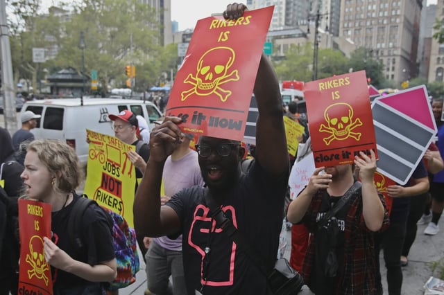 Protesters demonstrate in support of closing Rikers Island in Manhattan on Aug. 10, 2023..