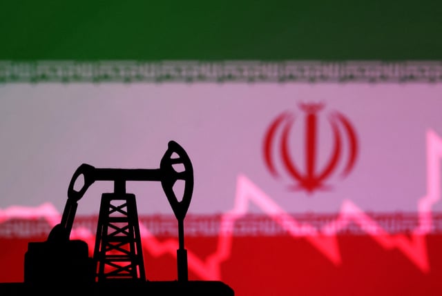 Iranian flag with stock graph and an oil pump jack miniature model are seen in this illustration taken October 9, 2023. REUTERS/Dado Ruvic/Illustration/File Photo