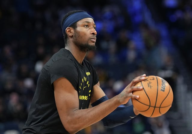 Jonathan Kuminga of the Golden State Warriors warms up prior to the start of the second half against the Sacramento Kings at Chase Center on March 13, 2025, in San Francisco.