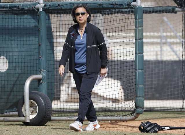 Feb 18, 2023; Jupiter, FL, USA;  Miami Marlins general manager Kim Ng watches drills during workouts at the Marlins practice facility.. Mandatory Credit: Rhona Wise-USA TODAY Sports/File Photo