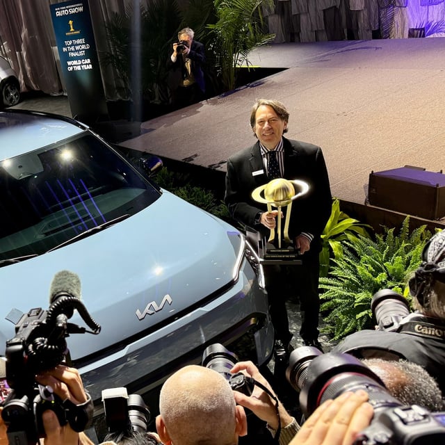 Kia's Steven Center accepts the award after the EV3 was awarded World Car of the Year at a presentation during the 2026 New York International Auto Show on Wednesday.