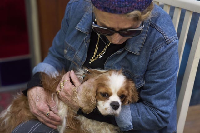 Rachel Dancyg holds her dog, Billie, on Wednesday, April 16, 2025. Israeli soldiers found Billie in the Gaza Strip, 18 months after she disappeared during Hamas' attack on Dancyg's Kibbutz of Nir Oz, in Binyamina, Israel. (AP Photo/Ariel Schalit)