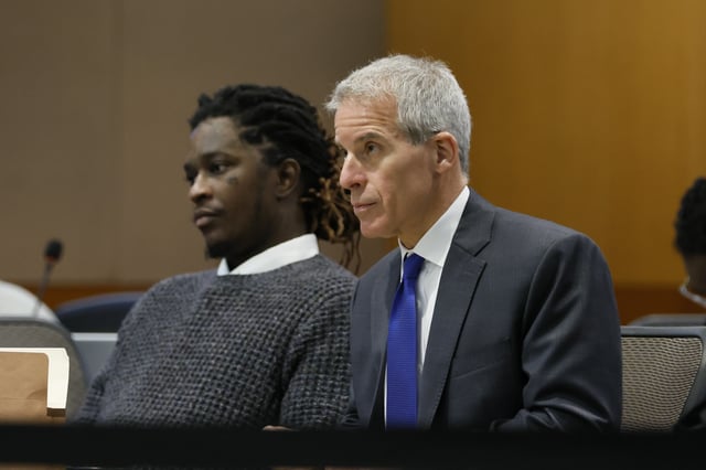 Young Thug, whose real name is Jeffery Lamar Williams, and his lawyer, Brian Steel, watch Judge Ural Glanville speak during the hearing of key witness Kenneth Copeland at the Fulton County Superior Court in Atlanta on June 10, 2024.