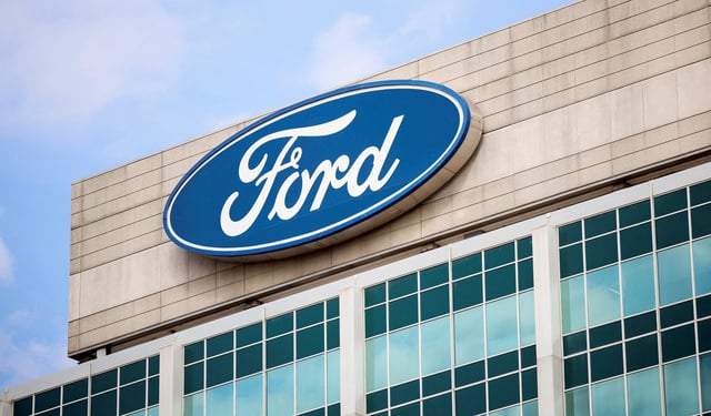 FILE PHOTO: A Ford logo is seen on the Ford Motor World headquarters in Dearborn, Michigan, U.S., March 12, 2025. REUTERS/Rebecca Cook/File Photo/File Photo