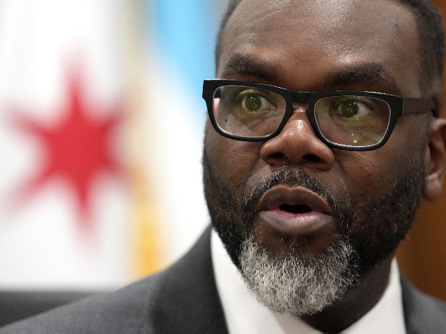 Chicago Mayor Brandon Johnson responds to a question in his City Hall office during an interview with The Associated Press Monday, May 6, 2024, in Chicago. The rookie mayor's bumpy first year has been a test of his progressive credentials. He's navigated an evolving migrant crisis, budget gaps, persistent crime and a troubled transit system to name a few. While there have been wins for workers and social services, he's struggled with businesses, police and fellow Democrats.