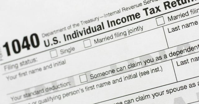 FILE - This July 24, 2018, file photo shows a portion of the 1040 U.S. Individual Income Tax Return form. The Trump administration is working on plans to delay the April 15 federal tax deadline for most individual taxpayers as well as small businesses. Treasury Secretary Steven Mnuchin told Congress on Wednesday, March 11, 2020, that the administration is "looking at providing relief to certain taxpayers and small businesses who will be able to get extensions on their taxes."