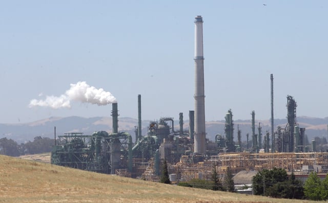 Gov. Jerry Brown is racing to convince state lawmakers to extend California’s cap-and-trade program which puts a price on carbon emitted by polluters, including oil refineries like the Valero Benicia Refinery seen Wednesday, July 12, 2017, in Benicia, Calif. The program has been closely watched around the world as a market-based way to reduce greenhouse gas emissions, but it expires in 2020. (AP Photo/Rich Pedroncelli)