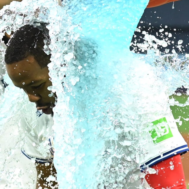 Toronto Blue Jays first baseman Vladimir Guerrero Jr is doused with sports drink following his team's defeat of the Atlanta Braves in interleague baseball action in Toronto on Wednesday, April 16, 2025. THE CANADIAN PRESS/Jon Blacker