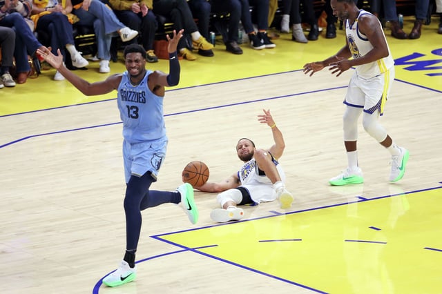 The Golden State Warriors’ Stephen Curry, center, reacts to being fouled by the Memphis Grizzlies’ Jaren Jackson Jr. during the first half of an NBA play-in tournament game in San Francisco, Tuesday, April 15, 2025.