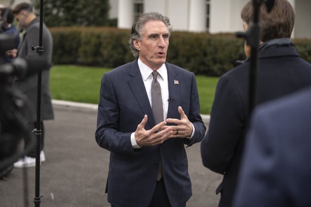 Interior Secretary Doug Burgum speaks with a reporter outside the West Wing of the White House, Thursday, April 10, 2025, in Washington. (AP Photo/Mark Schiefelbein)