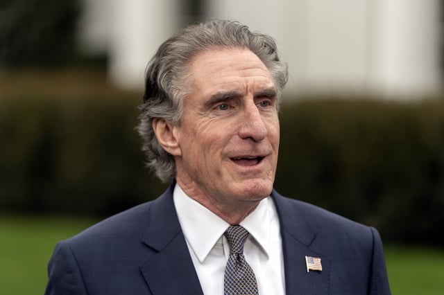 Interior Secretary Doug Burgum speaks with a reporter outside the West Wing of the White House, Thursday, April 10, 2025, in Washington. (AP Photo/Mark Schiefelbein)