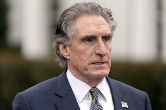 Interior Secretary Doug Burgum speaks with a reporter outside the West Wing of the White House, Thursday, April 10, 2025, in Washington. (AP Photo/Mark Schiefelbein)