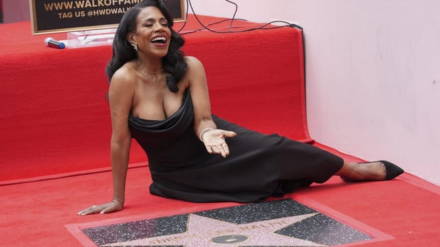 Sheryl Lee Ralph poses with her new star at a ceremony on the Hollywood Walk of Fame on Monday, April 16, 2025, in Los Angeles. (AP Photo/Chris Pizzello)