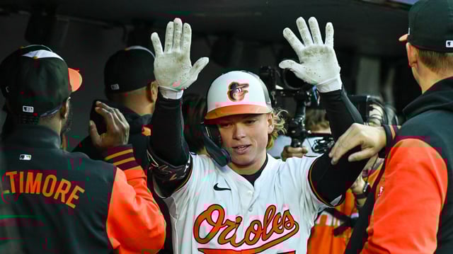 Orioles&#39; Jackson Holliday celebrated with teammates after launching a 424-foot grand slam off Guardians starter Gavin Williams in the second inning to put Baltimore up 4-0. (Kevin Richardson/Staff)