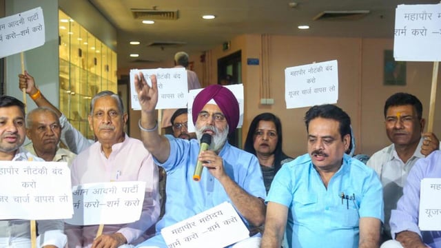 BJP members protest against hike in user charges outside the mayor's office at A-Block Civic Centre in New Delhi on Wednesday. (ANI)