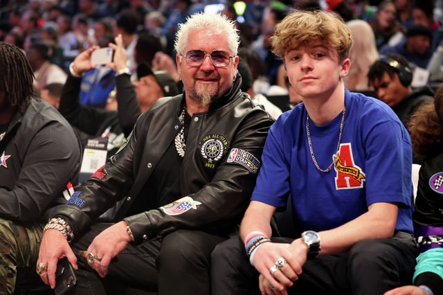 Guy Fieri poses with his son Ryder Fieri prior to the 2023 NBA All Star Game. He recently revealed that he requires all of his children to get two degrees before recieving their inheritance. 