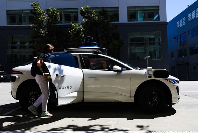 A client climbs into a Waymo vehicle on Harrison St. in San Francisco in 2024. The company wants to expand service in the South Bay.