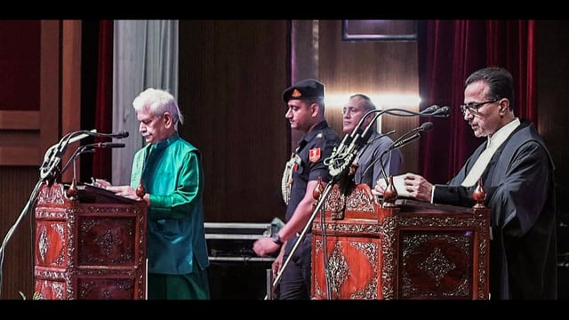 Jammu and Kashmir Lieutenant Governor Manoj Sinha administers the oath of office to Justice Arun Palli as the Chief Justice of the High Court of Jammu and Kashmir and Ladakh, at Convention Centre in Jammu on Wednesday. (ANI)