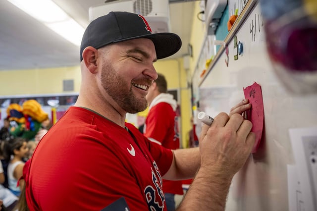 BOSTON, MA – DECEMBER 4: Liam Hendriks #31 of the Boston Red Sox greets students during a visit to the Hurley K-8 School as part of the 2024 Boston Red Sox Holiday Caravan on December 4, 2024 in Boston, Massachusetts. (Photo by Billie Weiss/Boston Red Sox/Getty Images)
