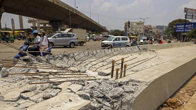 The concrete pillar of the Namma Metro collapsed, in Bengaluru, on Wednesday. An auto-driver was killed as its debris fell on his auto-rickshaw. (PTI)