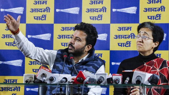 Aam Aadmi Party leader Durgesh Pathak with Atishi addresses a press conference, at party office in New Delhi.