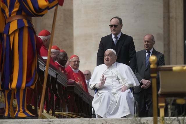 Pope Francis arrives at the end of the mass on Palm Sunday in St. Peter's Square at The Vatican, Sunday, April 13, 2025. (AP Photo/Gregorio Borgia)