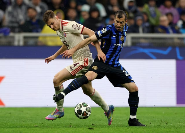 Soccer Football - Champions League - Quarter Final - Second Leg - Inter Milan v Bayern Munich - San Siro, Milan, Italy - April 16, 2025 Bayern Munich's Josip Stanisic in action with Inter Milan's Henrikh Mkhitaryan REUTERS/Claudia Greco