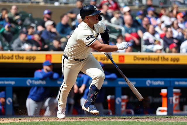 Apr 16, 2025; Minneapolis, Minnesota, USA; Minnesota Twins first baseman Ty France (13) hits a walk-off RBI single during the tenth inning against the New York Mets at Target Field. Mandatory Credit: Matt Krohn-Imagn Images