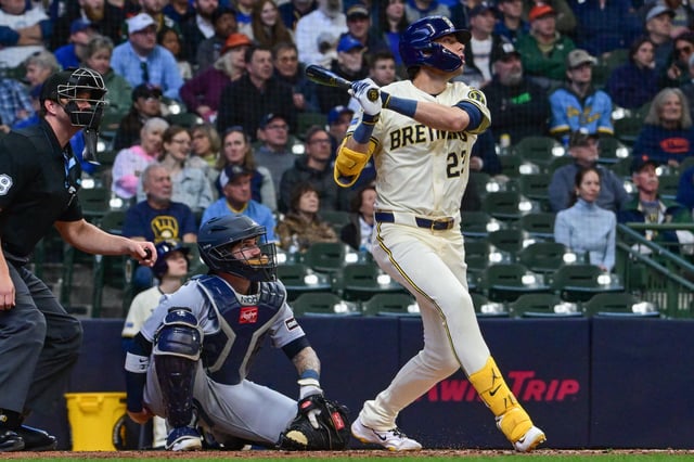 Apr 16, 2025; Milwaukee, Wisconsin, USA; Milwaukee Brewers designated hitter Christian Yelich (22) hits a solo home run in the third inning as Detroit Tigers catcher Tomas Nido (58) looks on at American Family Field. Mandatory Credit: Benny Sieu-Imagn Images