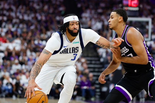 Apr 16, 2025; Sacramento, California, USA; Dallas Mavericks forward Anthony Davis (3) dribbles the ball against Sacramento Kings forward Keegan Murray (13) during the first quarter at Golden 1 Center. Mandatory Credit: Sergio Estrada-Imagn Images
