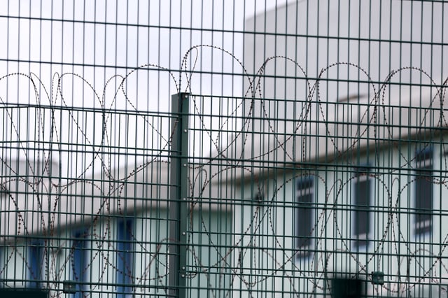 Barbed wire fence at the Tarascon prison near Avignon, France, April 16, 2025. REUTERS/Manon Cruz