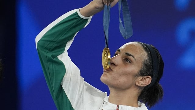 Gold medalist Algeria's Imane Khelif kisses her medal for the women's 66 kg final boxing match at the 2024 Summer Olympics, Friday, Aug. 9, 2024, in Paris, France. (AP Photo/John Locher, file)
