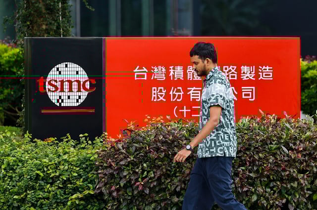 A man walks past a TSMC logo at the company&#39;s campus in Hsinchu, Taiwan on April 16, 2025.