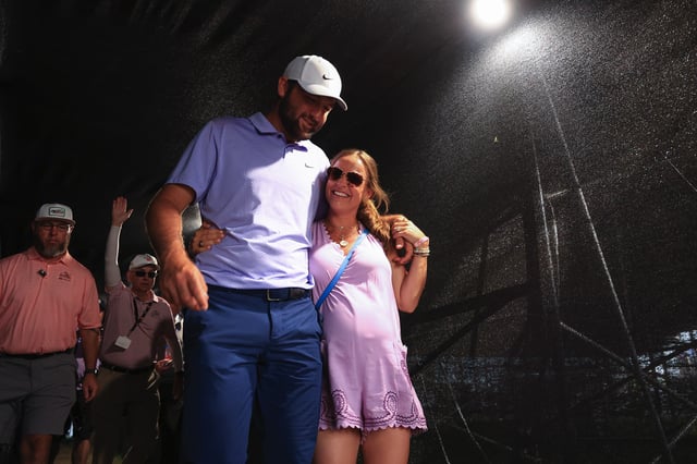 ORLANDO, FLORIDA - MARCH 10: Scottie Scheffler of the United States walks with his wife Meredith to the clubhouse after winning the Arnold Palmer Invitational presented by Mastercard at Arnold Palmer Bay Hill Golf Course on March 10, 2024 in Orlando, Florida. (Photo by Mike Ehrmann/Getty Images)