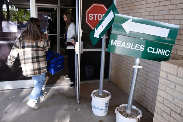 Doses of the measles, mumps and rubella vaccine are delivered to the Andrews County Health Department in Andrews, Texas, on April 8.