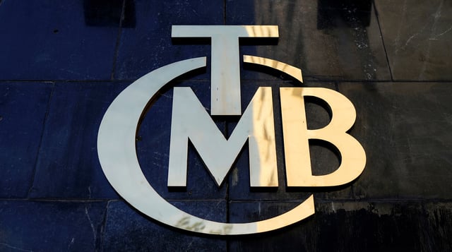 A logo of Turkey's Central Bank (TCMB) is pictured at the entrance of the bank's headquarters in Ankara, Turkey April 19, 2015. REUTERS/Umit Bektas/File Photo